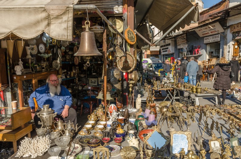 Stalls selling antiques and vintage items at Plateia Avyssinias, a Sunday treasure market in Monastiraki, Athens - unique hidden spots in Athens away from tourists