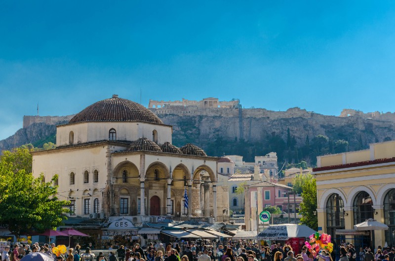 Monastiraki in Athens - Tzistarakis Mosque in Monastiraki Square with the Acropolis rising behind and lively street life below