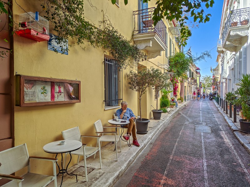 Best Time to Visit Plaka - Morning scene in Plaka: small café tables, pastel façades and a calm side street away from busy Adrianou.