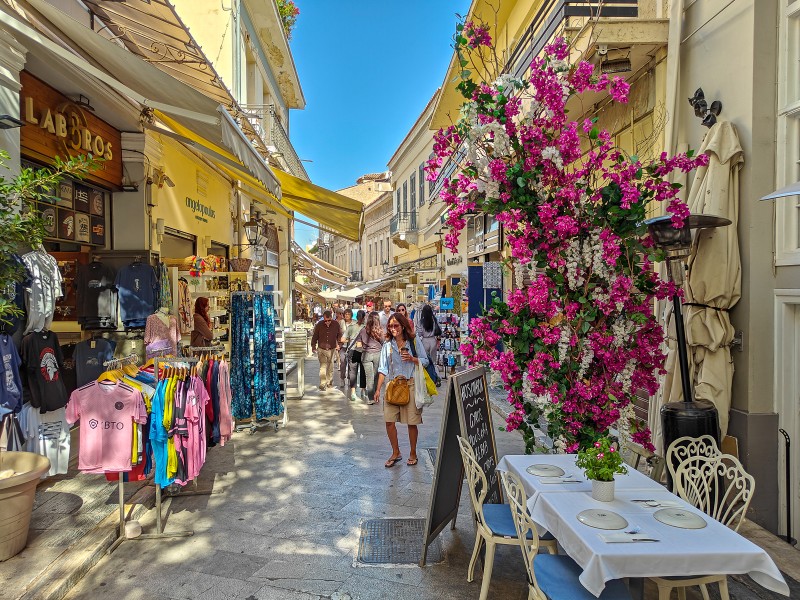 Where to stay in Athens - Bustling pedestrian street in Plaka, Athens, filled with shops, cafés, and flowers — a traveler favorite for walkability and local color.