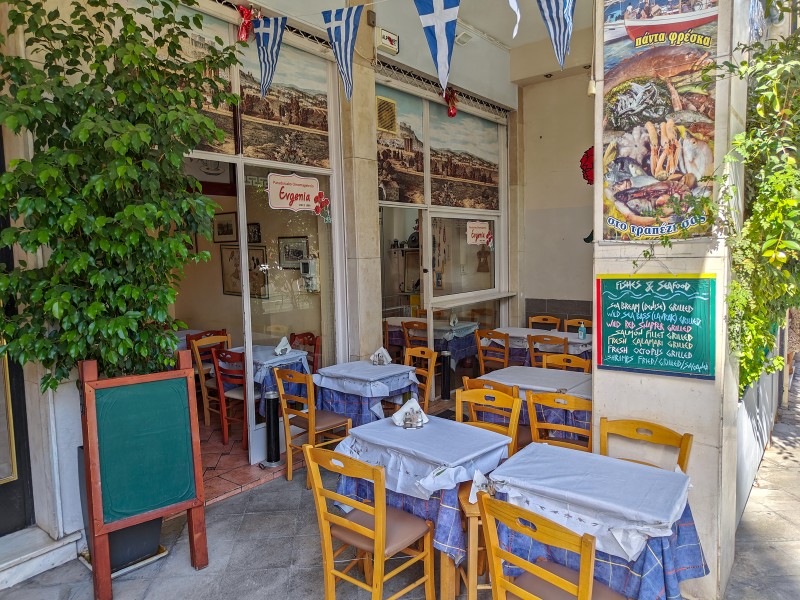 restaurants in Syntagma - Outdoor tables at Evgenia, a traditional Greek taverna in Syntagma, Athens, with blue-checkered tablecloths and fresh seafood menu