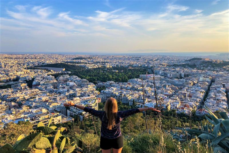 What clothes to pack for Athens in October - a girl looking the athens view