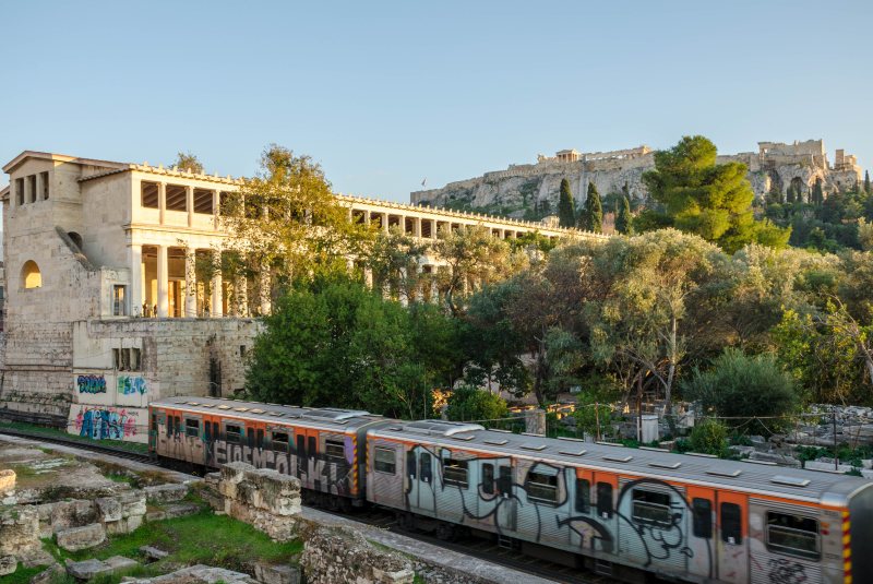 Athens Metro passes Acropolis near Thissio station in Athens