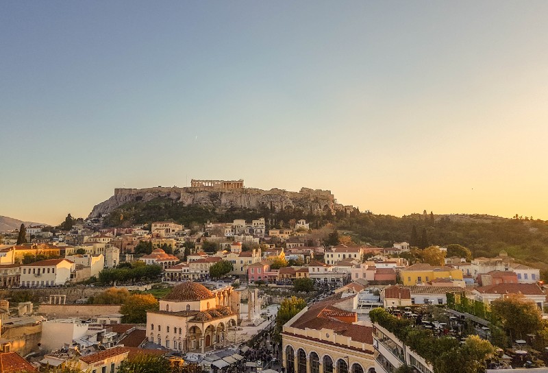 Rooftop view from A for Athens hotel overlooking Monastiraki Square and the Acropolis at sunset