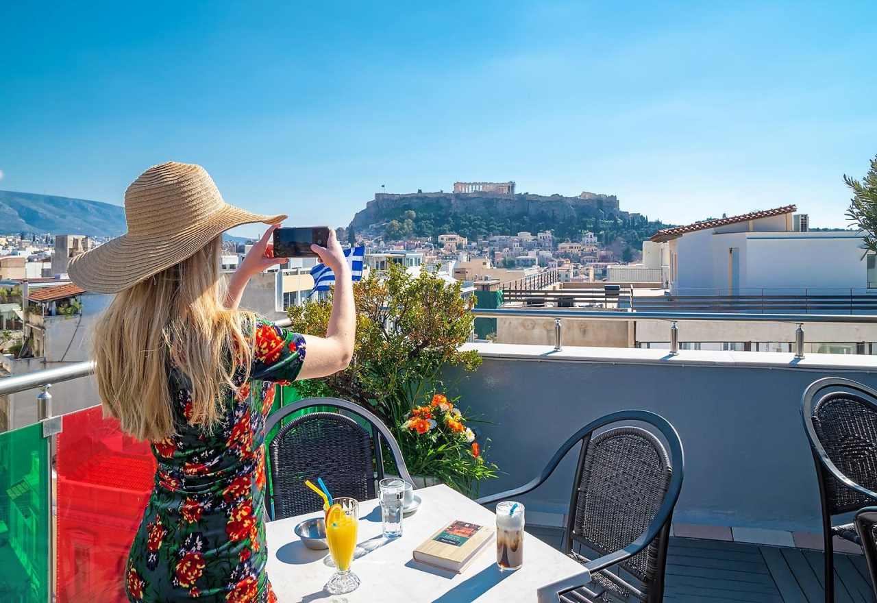 tourist in a hotel with acropolis view