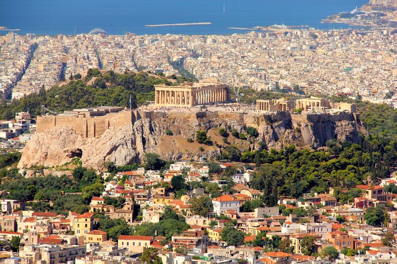 Hotels Near the Acropolis - panoramic view of the acropolis hill and parthenon with plaka neighborhood in athens